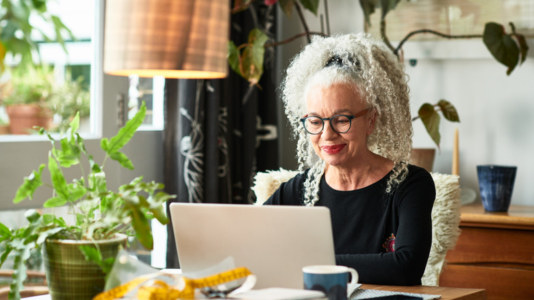 Mature businesswoman on video conference call on a laptop