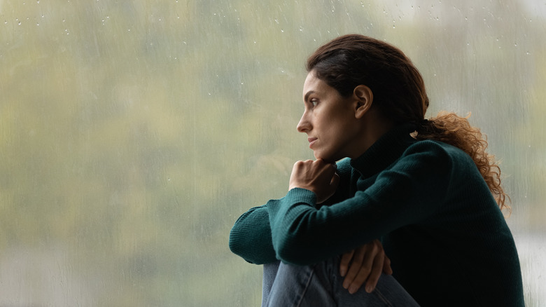 woman sitting on a rainy day