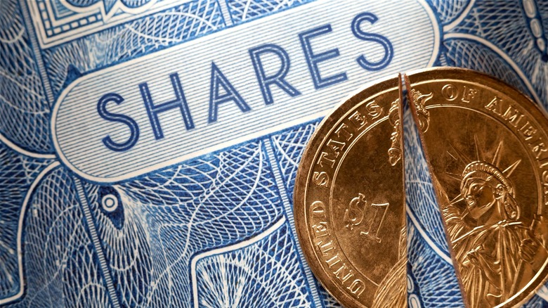 "SHARES" with split dollar coin