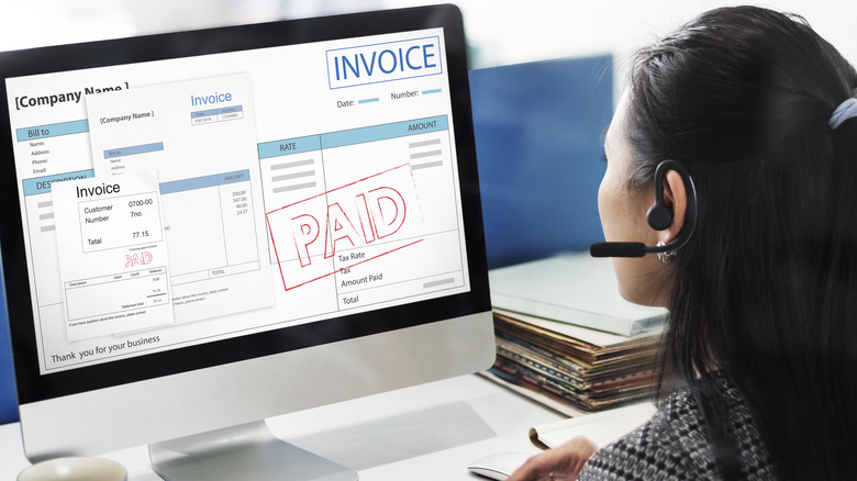 Worker accepting invoice payment