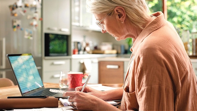 Older person working on financials