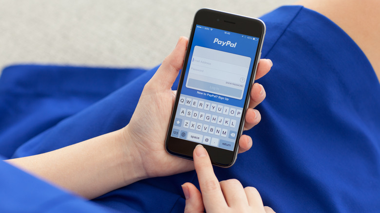 Woman using Paypal app