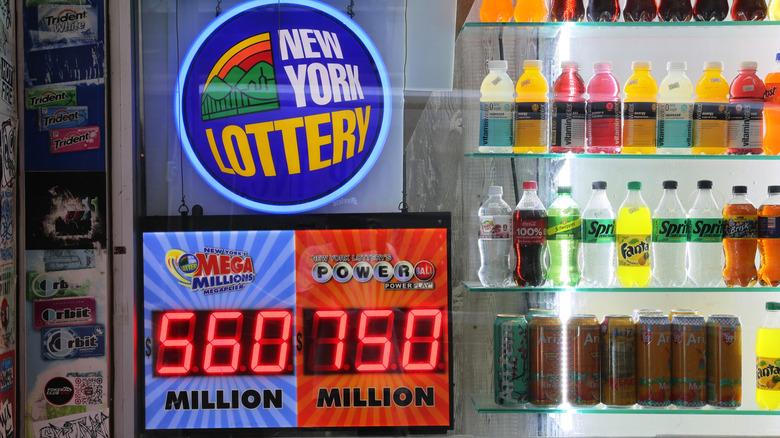 A neon New York Lottery sign inside a bodega.