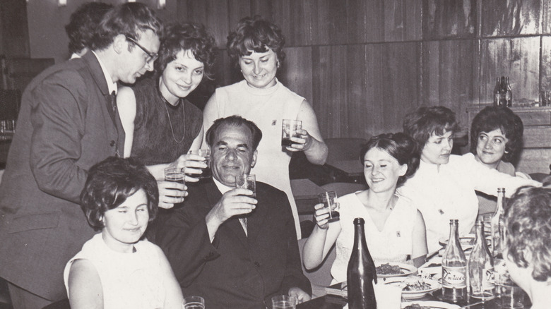 Family toasts older gentleman