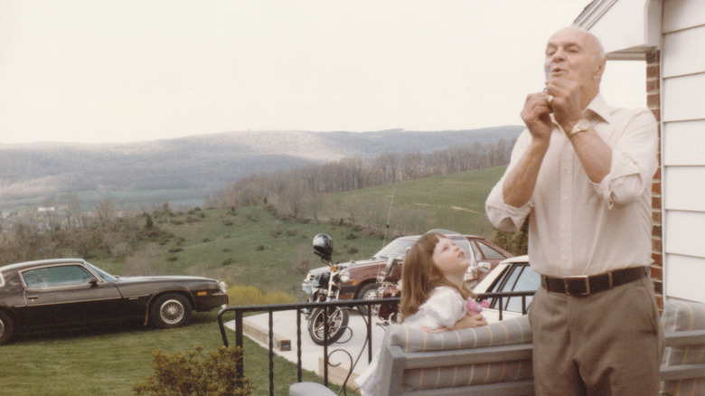 grandfather blowing bubbles in photo from 1980s