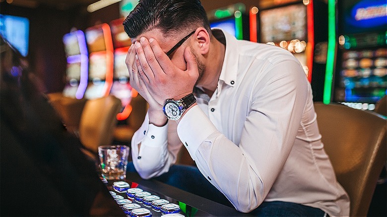 Upset person losing at casino