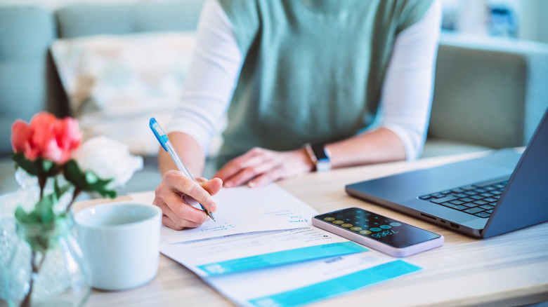 Young woman filing her taxes