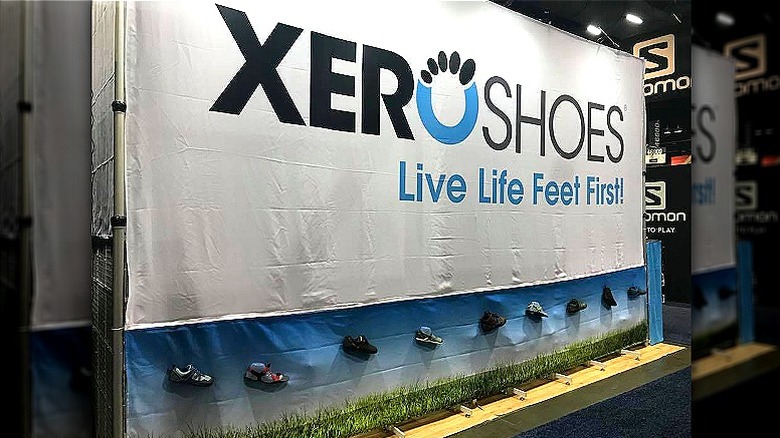 Display reads Xero Shoes: Live Life Feet First! at Outdoor Retailer 2018