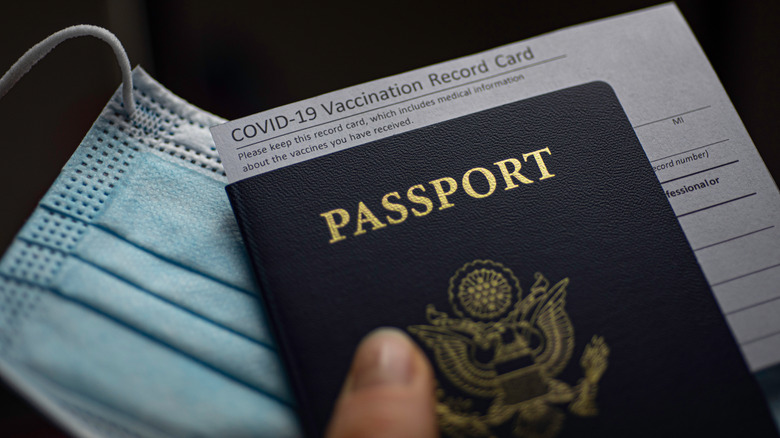 A vaccination record card inside a passport