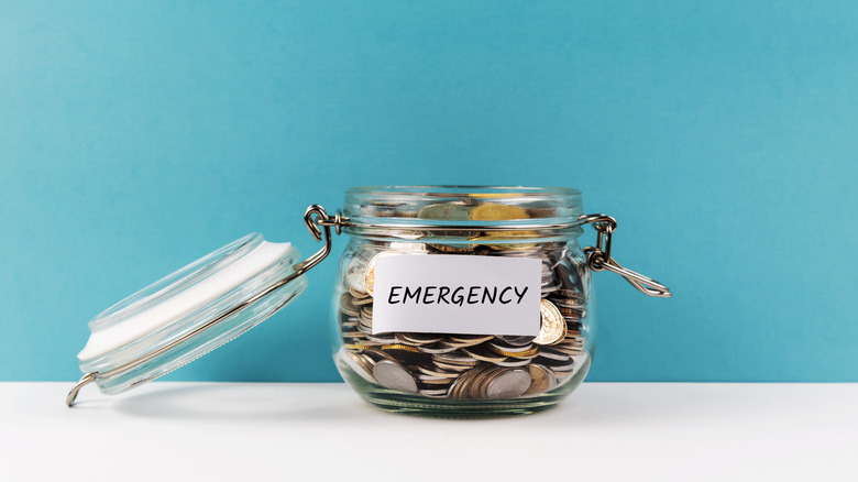 Emergency fund jar filled with coins