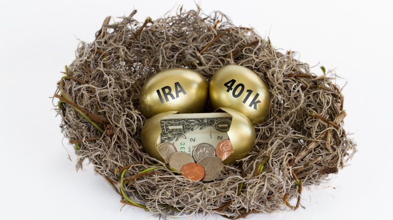 IRA and 401k written on gold eggs in a retirement nest