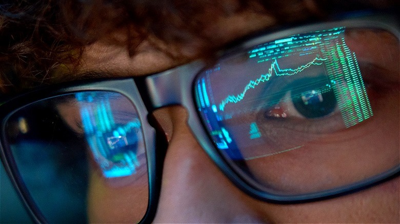 Stock chart reflection investor's glasses