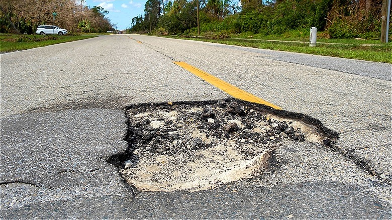 Damaged road with pothole