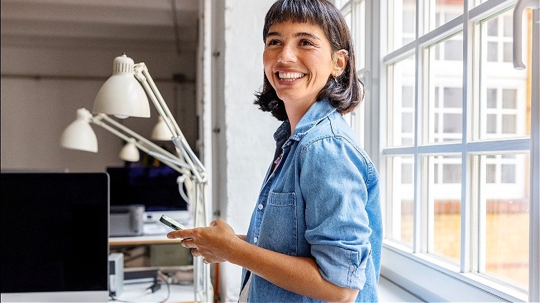 Person by window smiling