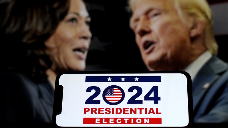 Smartphone with Kamala Harris-Donald Trump background