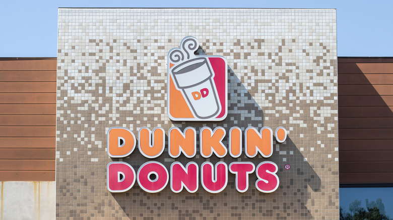 A Dunkin' Donuts logo on a mosaic front wall in Long Beach, CA.