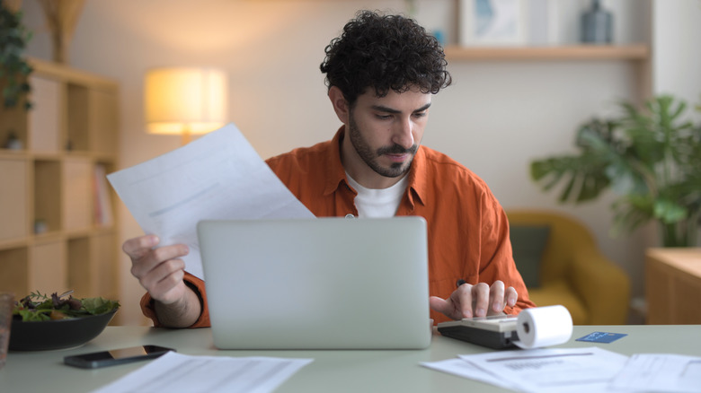 man filing taxes online