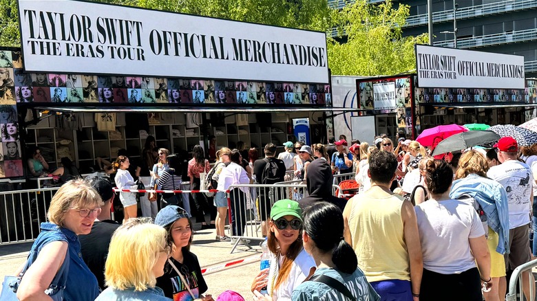 Fans outside concert merchandise booth