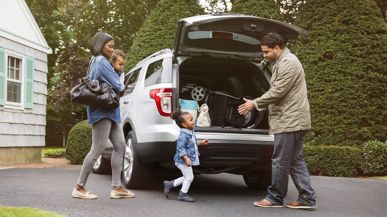 A family loading into a car