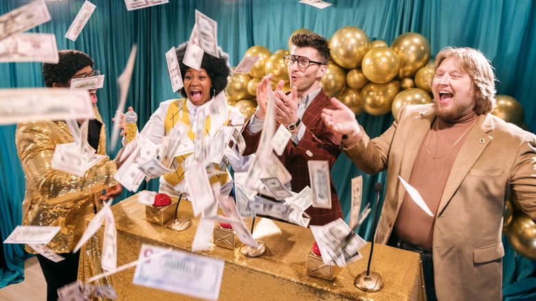 A group of excited people winning the lottery while it rains money