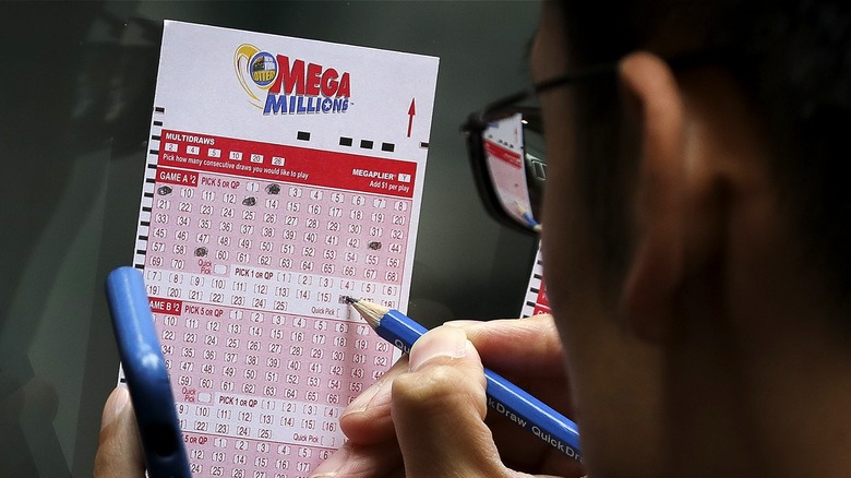 Person choosing Mega Millions numbers