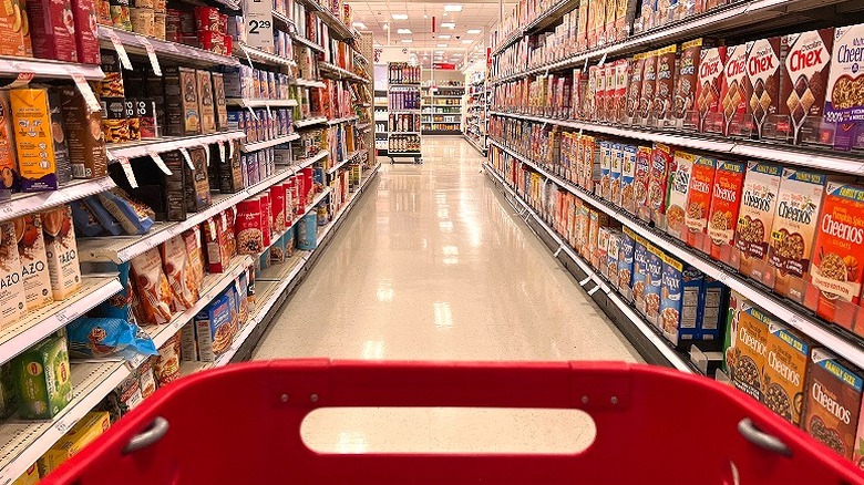 Shopping cart in retail store aisle