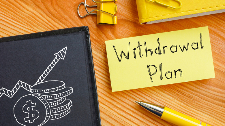 Withdrawal plan written on sticky note