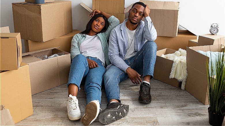 A couple relaxing after moving