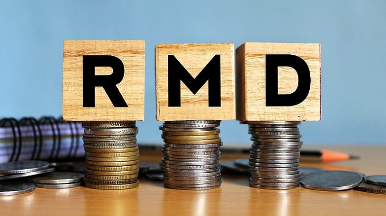 RMD spelled in blocks sitting atop coin stacks