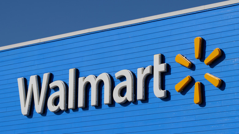 A closeup of the Walmart logo on the exterior of a retail location.