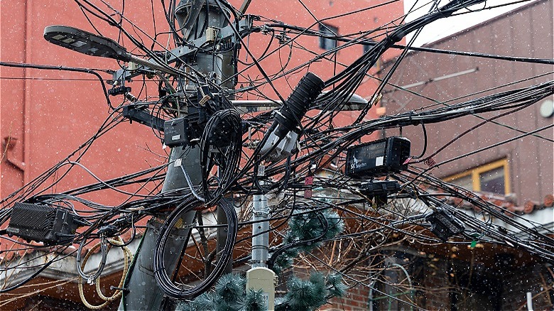 A utility pole with wires