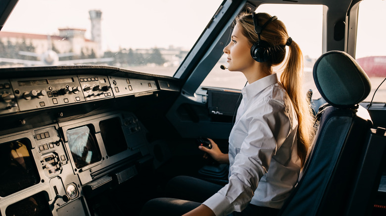 A woman piloting a plane