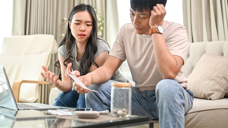 Couple discussing finances at home
