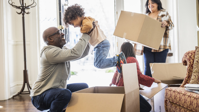 family unpacking in new house