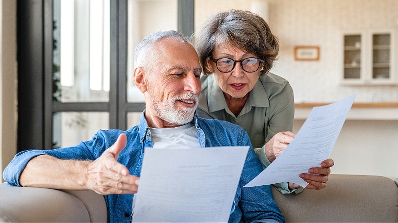 Retired couple looking over paperwork