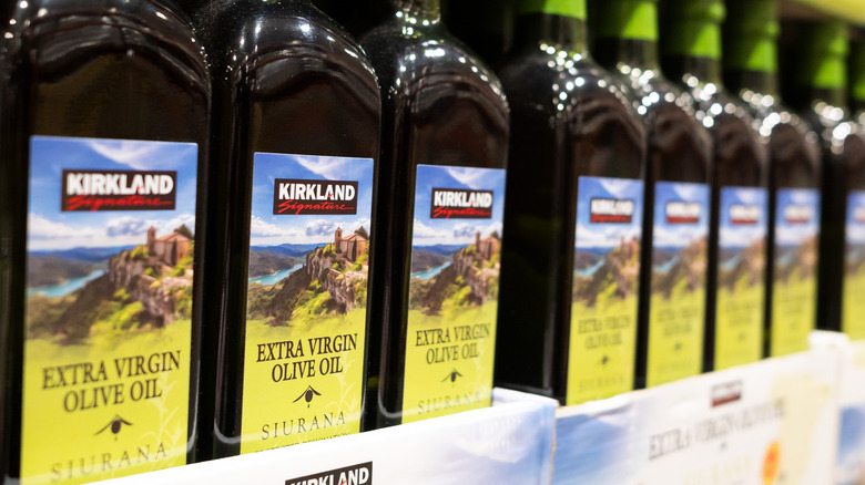 A row of Kirkland Signature extra virgin olive oil.