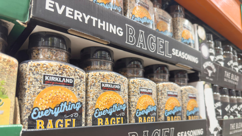 A row of Kirkland Signature Everything Bagel Seasoning tubs.