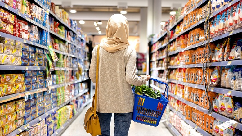 Person walking through grocery aisle