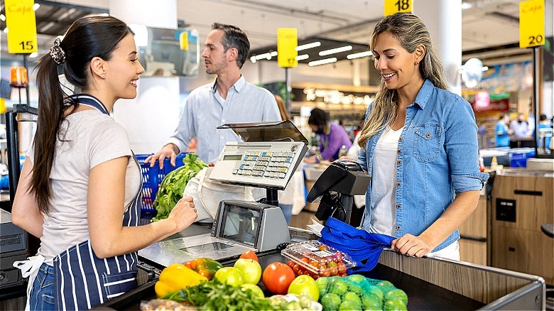 Customer at grocery store checkout