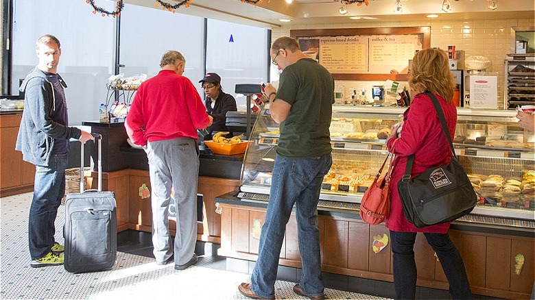 Travelers at airport sandwich shop