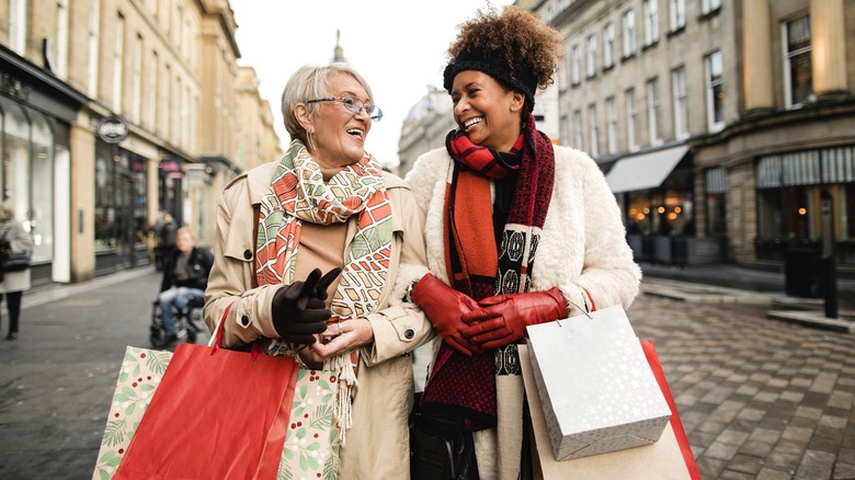 Two people smiling after shopping