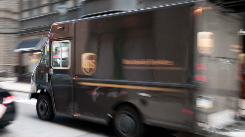 A UPS shipping truck in motion