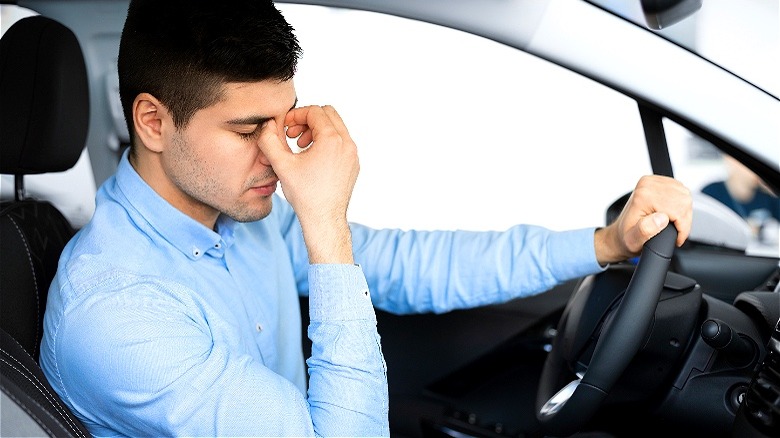 Frustrated car buyer in car